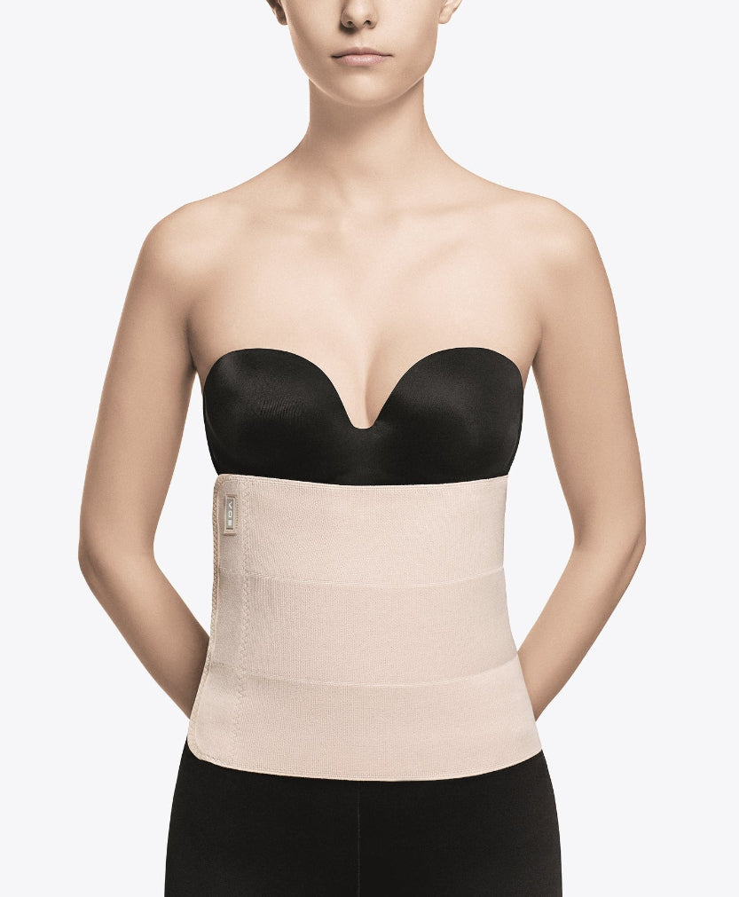 Faja de compresión médica postquirúrgica beige con sujetador negro, cómoda y segura para uso diario.