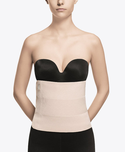 Faja de compresión médica postquirúrgica beige con sujetador negro, cómoda y segura para uso diario.